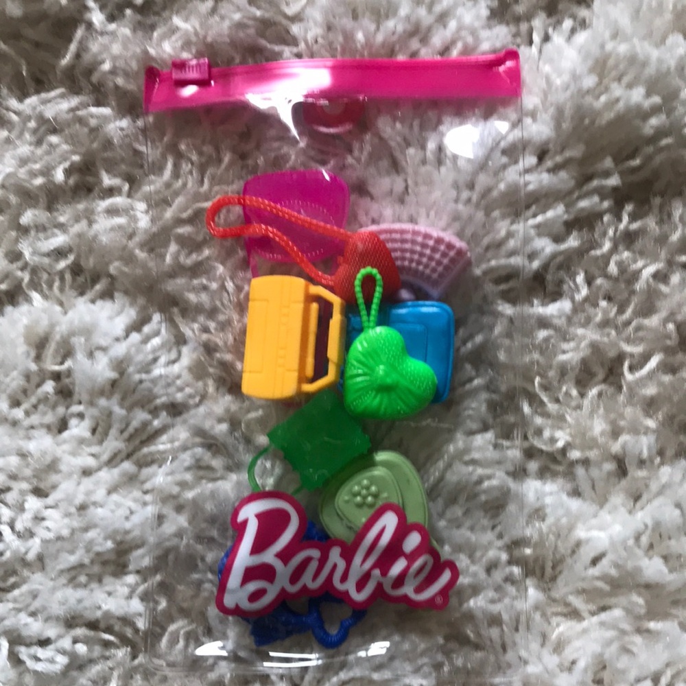 Barbie collection of 8 purses and an radio